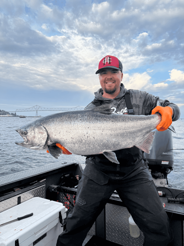 Captain Steve holding a big fall chinook on the Columbia River